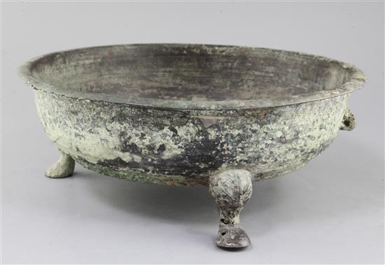 A Chinese archaic bronze tripod water basin, Pan, Warring States period, 4th/2nd century B.C., 39cm diameter, holes beneath rim